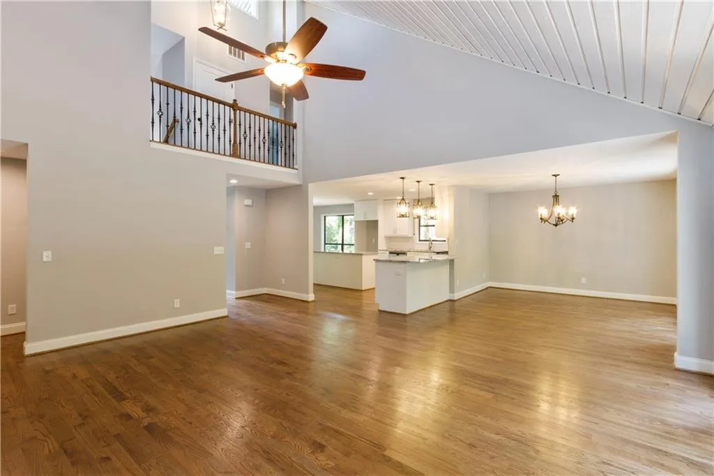Open-concept renovation with a connected kitchen and living area finished in a cohesive palette.